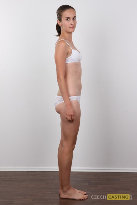 Barely legal bitch girl lady gets totally undressed before sitting atop a stool