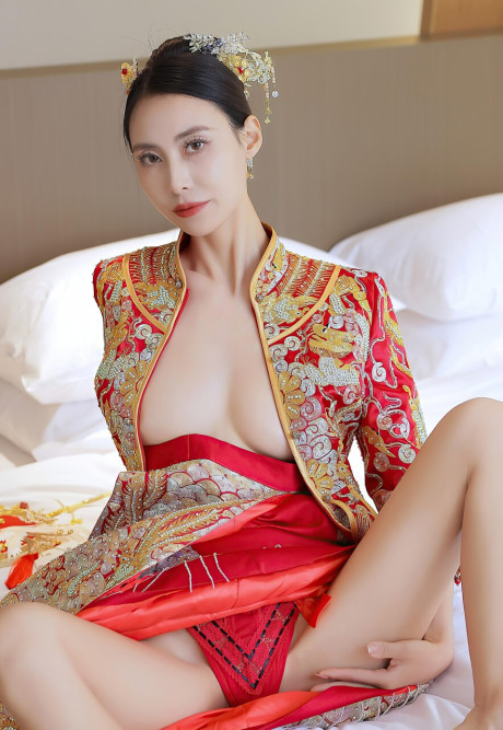 Gorgeous chinese whore lady sports nipple pasties while getting totally undressed