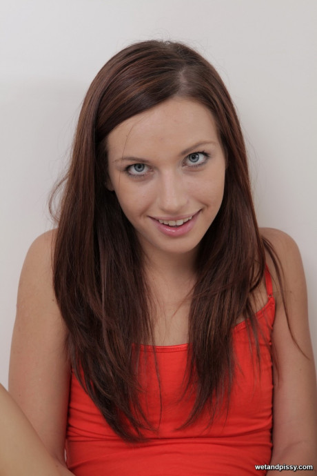 Barely legal young Mary Jane Johnson takes a pee in the sink & toys her muff