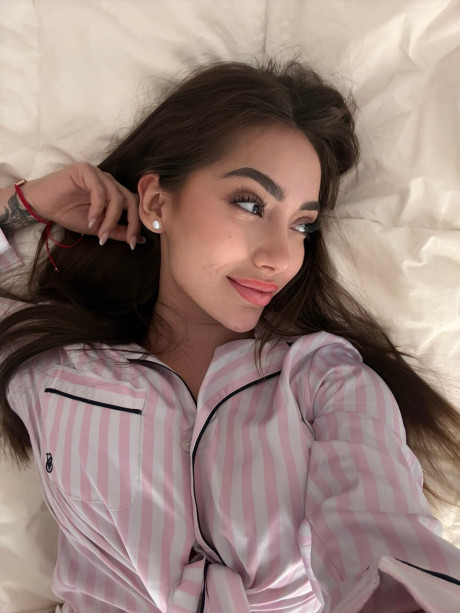 Solo model Haleema Ahmed takes a bunch of self shots while fully clothed