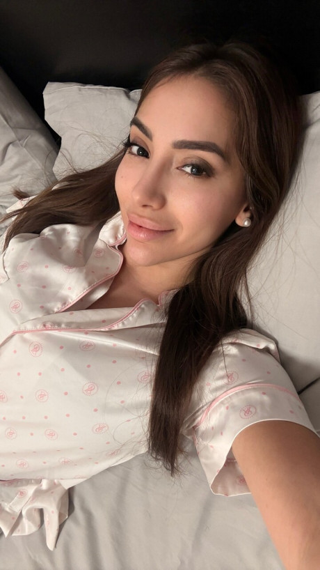Solo model Haleema Ahmed takes a bunch of self shots while fully clothed