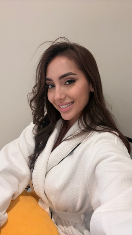 Solo model Haleema Ahmed takes a bunch of self shots while fully clothed