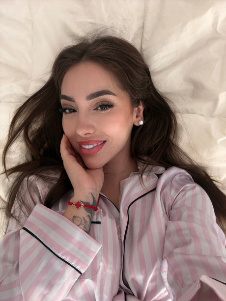 Solo model Haleema Ahmed takes a bunch of self shots while fully clothed