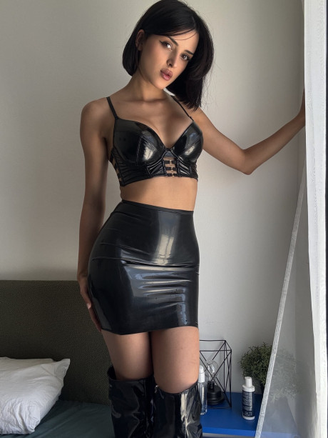Solo model shows her firm melons in ebony leather clothing and thigh boots