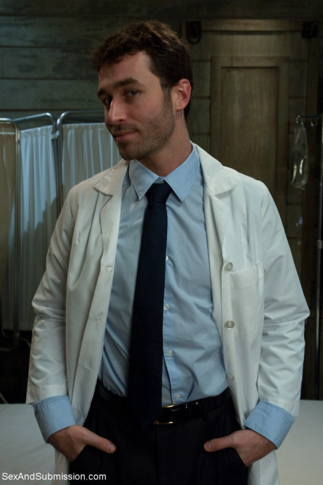 Cutie Bobbi Starr posing in her cute outfit at the BDSM sex club