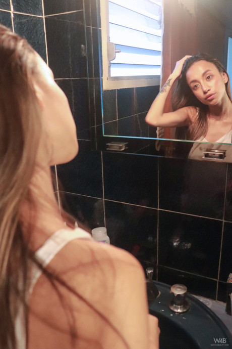 Sexy young Camila Luna shows her amazing boobs & behind while smoking