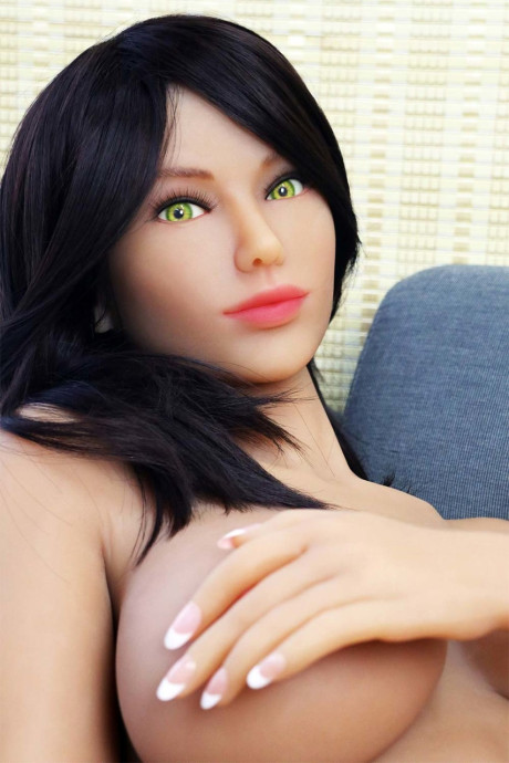 Stunning sex doll Bibi flaunting her gigantic tits and bubble booty on the sofa