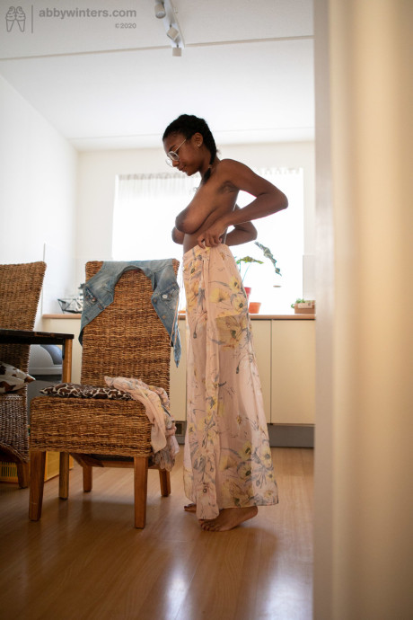 Ebony teen with a lovely behind and enormous boobies Selena D dresses in a white dress
