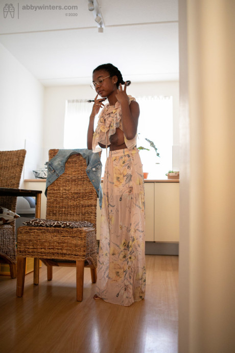 Ebony teen with a lovely behind and enormous boobies Selena D dresses in a white dress