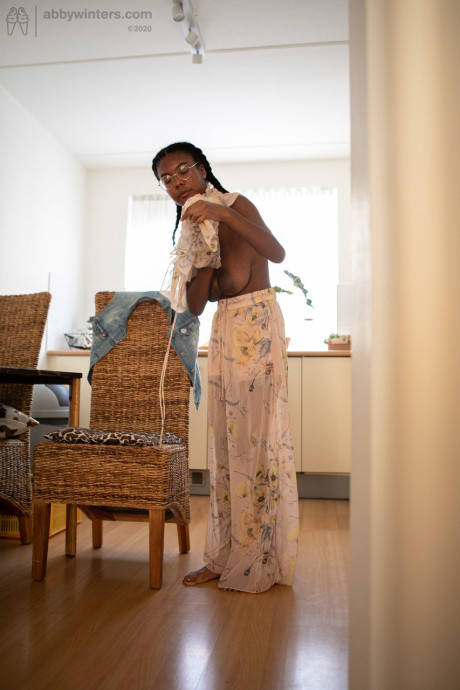 Ebony teen with a lovely behind and enormous boobies Selena D dresses in a white dress