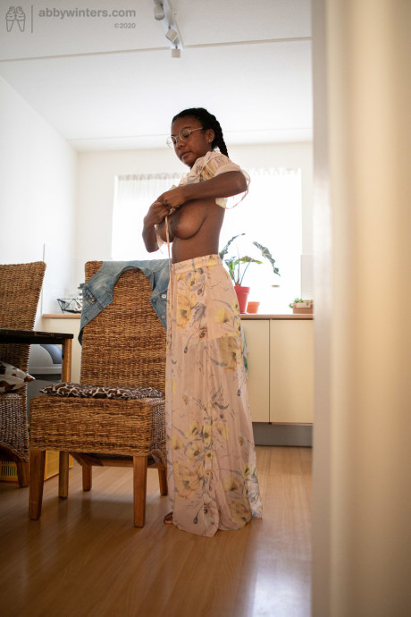 Ebony teen with a lovely behind and enormous boobies Selena D dresses in a white dress