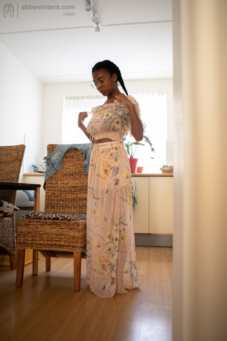Ebony teen with a lovely behind and enormous boobies Selena D dresses in a white dress