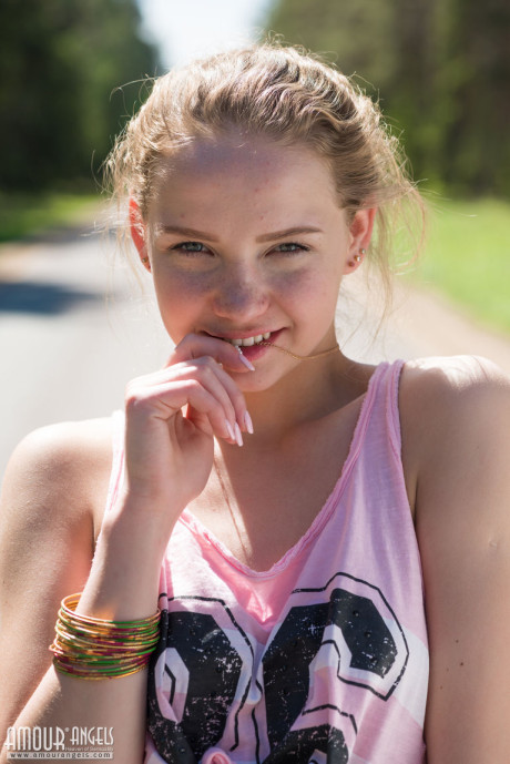 Fresh teen yellow-haired slut gf girl Faina gets undressed in middle of road wearing roller blades