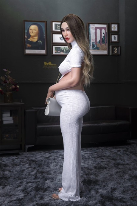 Stylish pregnant sex doll Emer flaunts her hot monstrous breasts in a solo