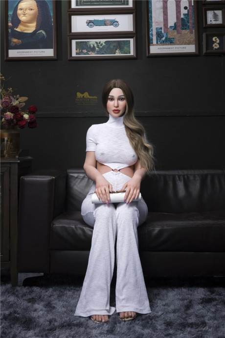 Stylish pregnant sex doll Emer flaunts her hot monstrous breasts in a solo
