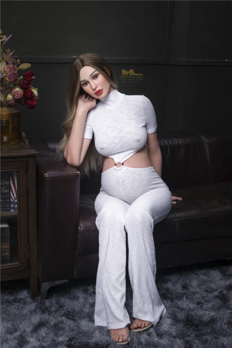 Stylish pregnant sex doll Emer flaunts her hot monstrous breasts in a solo