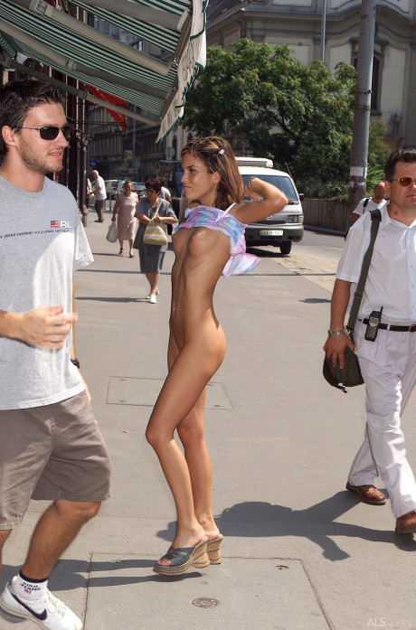 Shameless teen Nella poses nude in public & exposes her fake boobies & bald twat