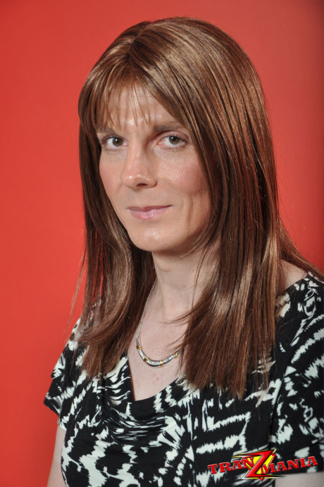 One seriously fine shemale posing in her short skirt and nylon stockings