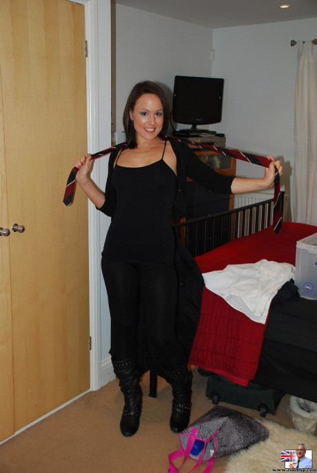 Schoolgirl brunette Lucy fingering her pussy in stockings and boots
