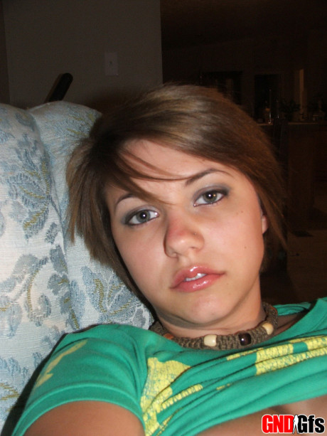 Fresh young looking amateur takes self shots of her enormous natural tits