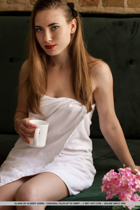 Glamour model Alaine removes a towel and pantyhose to get totally naked
