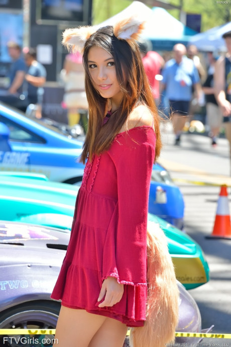 Glamour babe in a gorgeous dress Melody teasing with pretty upskirt in public