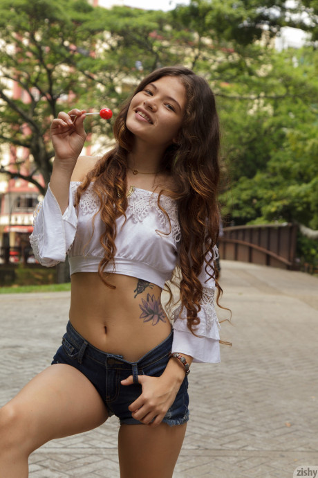 Amateur young Lejandra Baez shows her tits and sexy nips in a solo