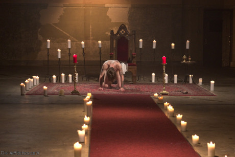 Horny dommes drip hot wax on a bound man back in a secret BDSM sex ritual