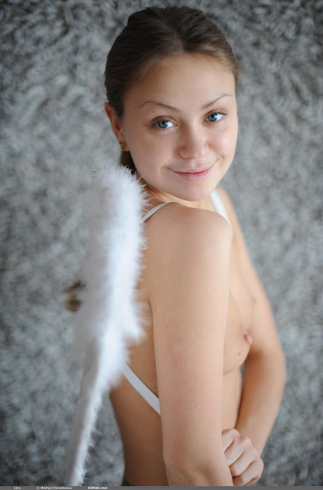 Skinny angel Liza shows off her tiny boobies and poses erotically in the nude