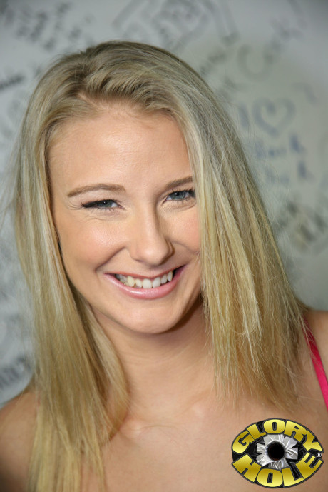 Blondie Natalie Norton sits on the toilet while swallowing BBC through a gloryhole