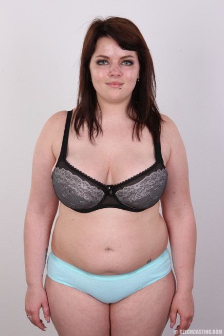 Amateur fatty Katherina stands nude before sitting to show her snatch