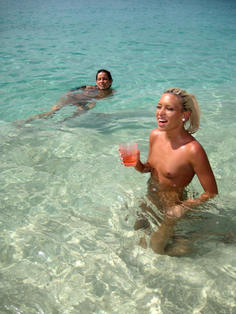 Insatiable young skanks smoking, peeing and getting fingered on a sandy beach