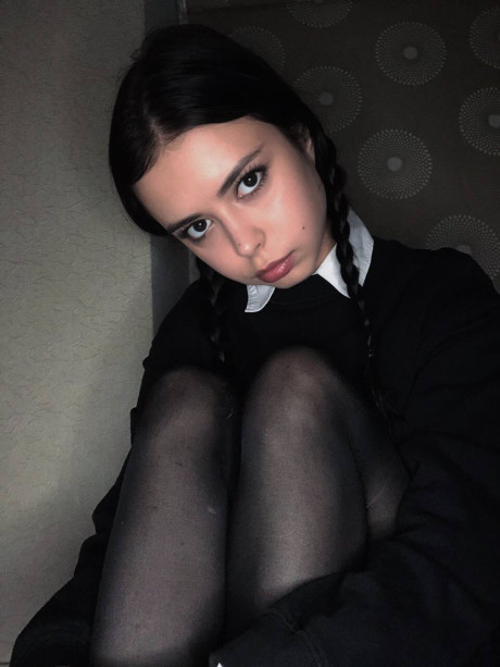 Ravishing sweet brunette young Molly Lo changes into a Wednesday Adams look