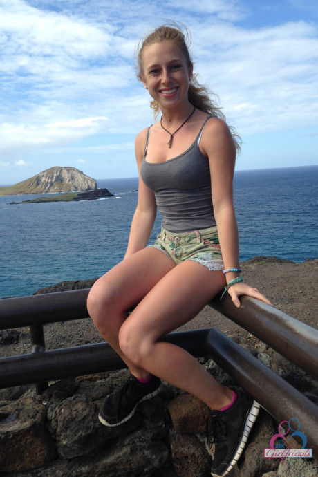 Amateur GF Taylor Whyte poses in a tight shirt & shorts by the sea