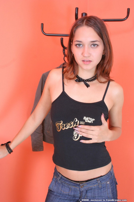 Cute nympho Ashley loses her jeans and poses naked on the floor