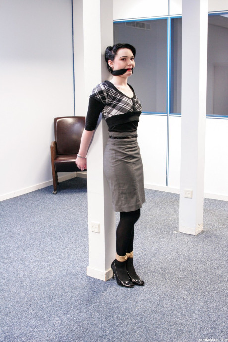 Submissive short haired cutie Lilly being tied up at the office
