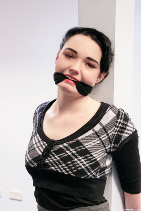 Submissive short haired cutie Lilly being tied up at the office