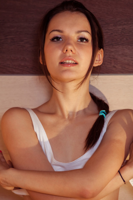 Adorable young Iva strips and spreads her beaver while eating a fruit salad