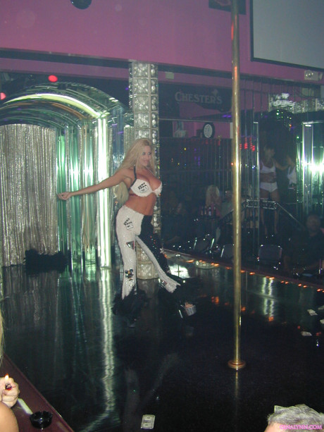 Charming yellow-haired Gina Lynn takes to a stripper stage in a thong and heels