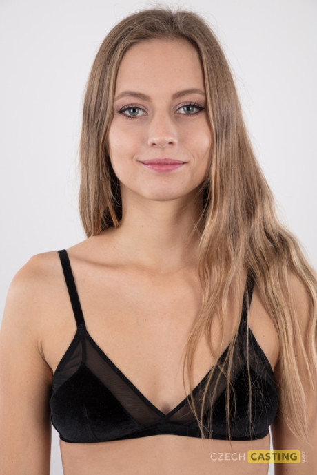 Tall young Eliska stands totally naked while making her undressed modeling debut