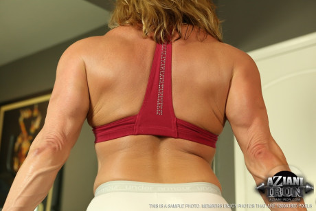Sexy cougar Wanda Moore shows her horny clitoris while working out