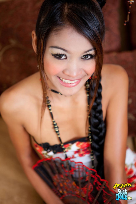 Thai sweety Tong strips her lace panties and shows her trimmed pussy