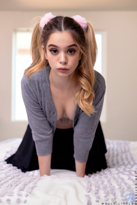 Little pigtailed schoolgirl Molly Little undresses and plays with her muff