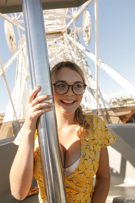 Nerdy amateur babe Gabbie Carter lets out her big titties in at amusement park