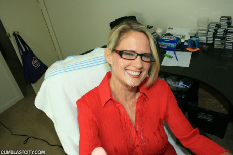 Fully clothed cougar yellow-haired in glasses gives a handjob and gets bukkaked