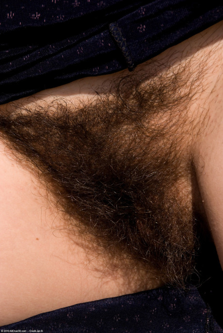 Naughty older old lady Sandra K shows her melons and toys her bushy beaver outdoors