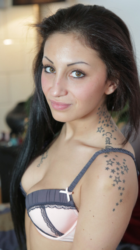 Inked German amateur poses undressed and teases with her nice tits