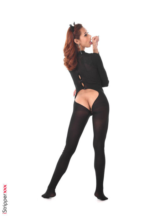 Redheaded hispanic female toys her anus after removing a bodystocking