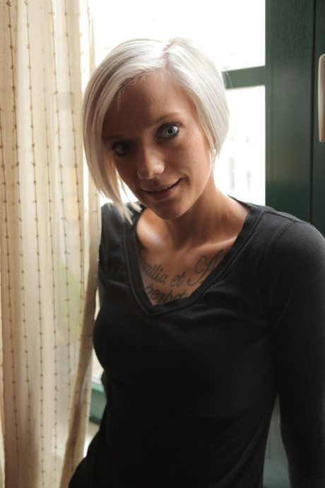 Beautiful tattooed babe shows her pretty delicious boobs and her hot butt