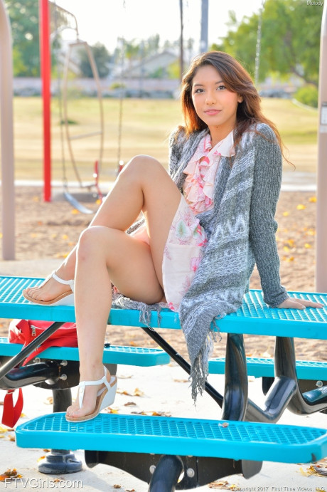 Attractive teenie Melody flaunts her delicious vagina and round ass in the park